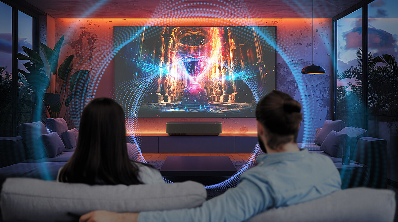 Epson EH-LS970B ultra-short-throw 4K laser projector displaying a vibrant cinematic scene in a modern living room